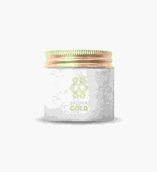 A jar of natural gold cream on top of white background.