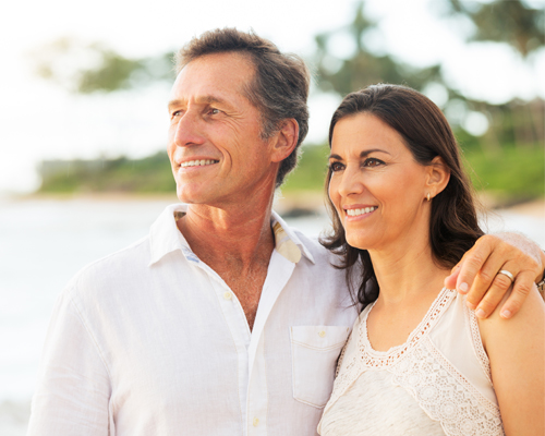 A man and woman smiling for the camera.